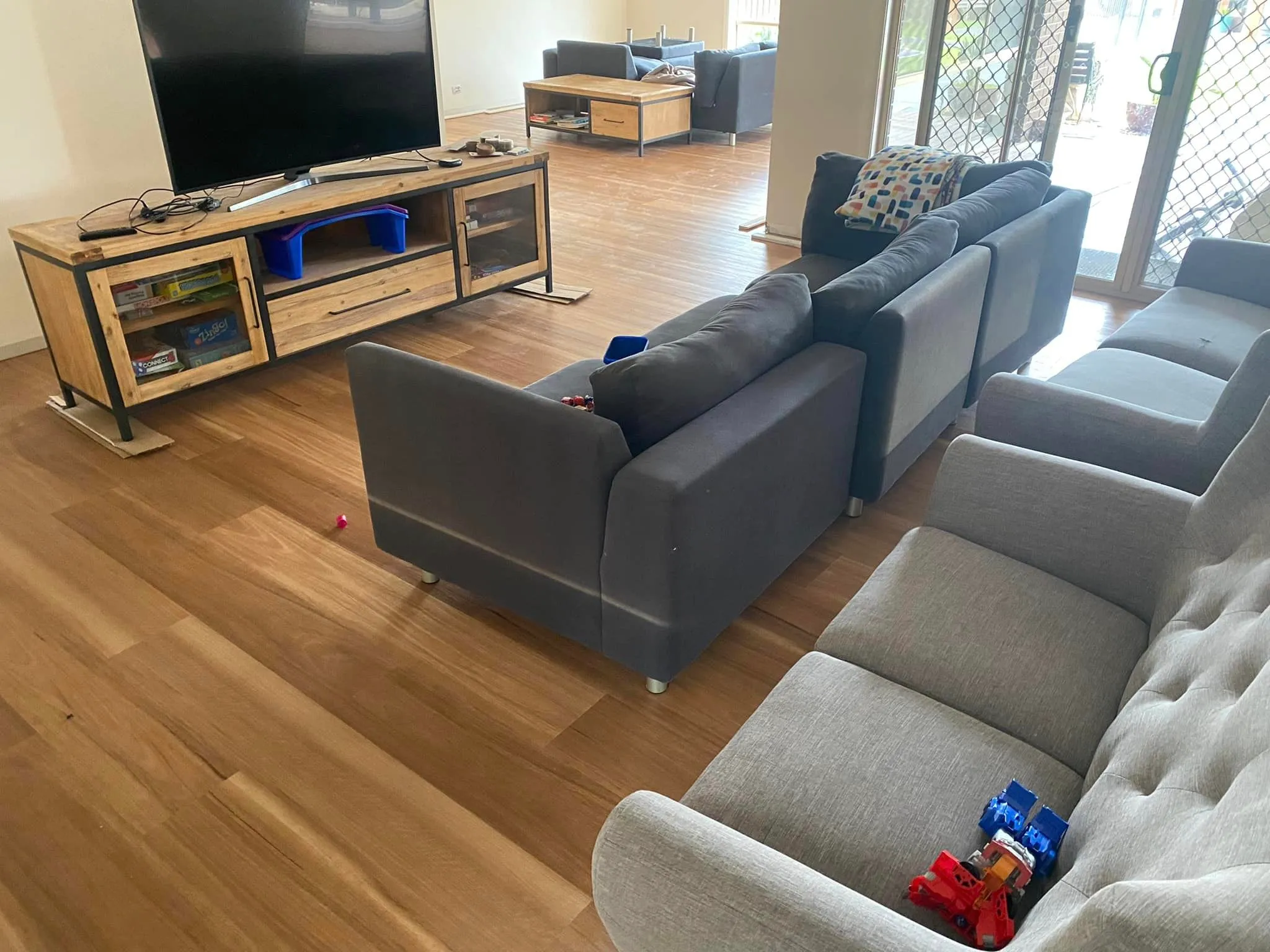 Timber-look hybrid flooring in an open living room